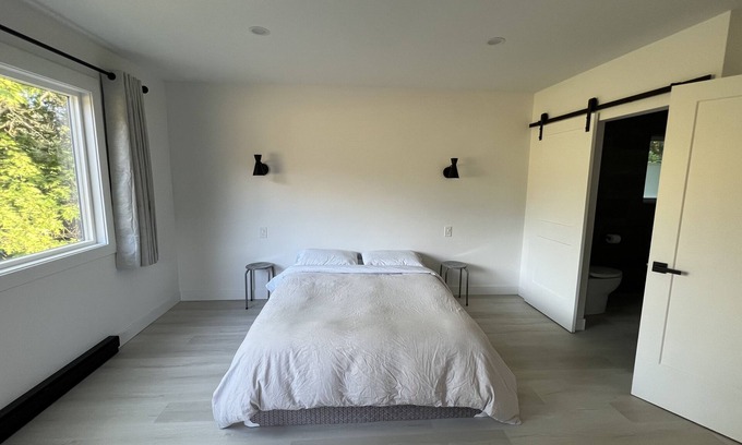 Port Alberni House | Inviting Master Bedroom with Ensuite and Private Balcony