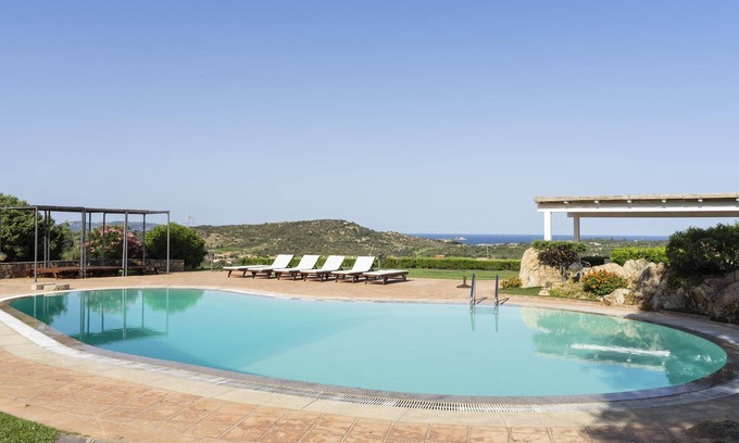San Teodoro Apartment | Oceanfront Apartment with Pool, 9/10 Guest Rated Retreat