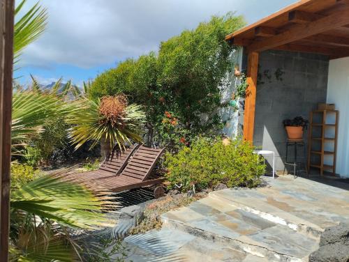 Urbanizacion Famara House | Picturesque Bungalow with Ocean Views and Lush Garden