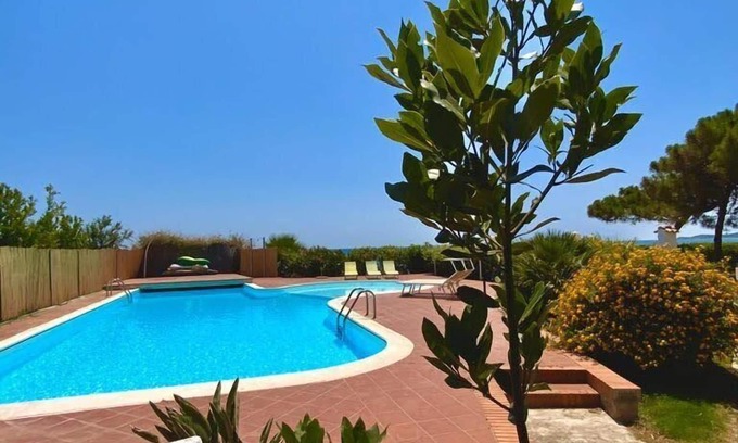 Sarroch Villa | Idyllic Split Villa with Beach Access, Pool & Tennis Court