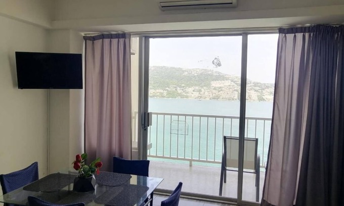 Club Deportivo Apartment | Inviting Twin Towers Suite with Balcony & Sea View Awaits