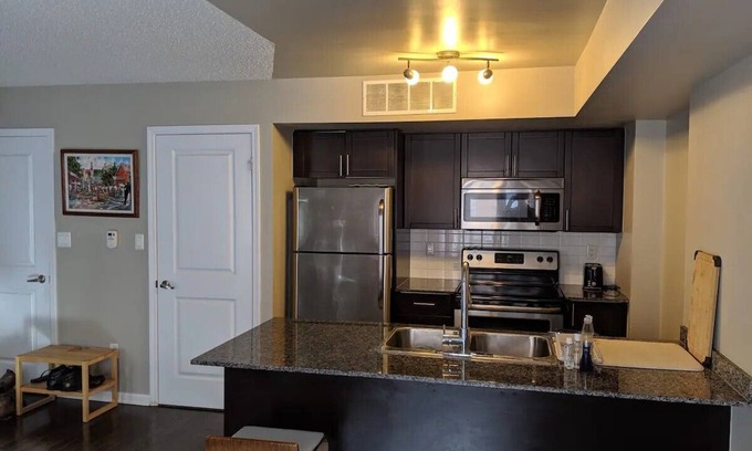 Wallace Emerson House | Inviting Three Story Townhouse with Patios and Parking