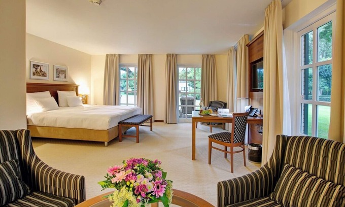 Ootmarsum Hotel | Beautifully Lit Room Overlooking Lush Parkland in Ootmarsum with Wellness Area