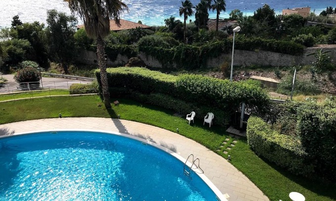 Letojanni Apartment | Belù: Poolside Getaway with Breathtaking Sea Views