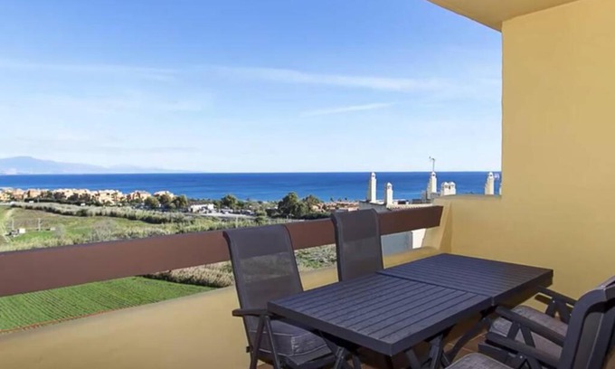 Puerto de la Duquesa Apartment | Elegant Apartment Steps from the Beach with Ocean View
