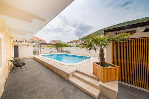 Cove Rogacic House | Experience Bella Vista Suites: Rated 9/10 with Pool Access