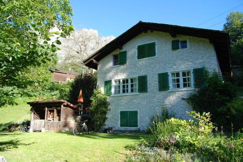 Schwanden House | Idyllic Bergbauernhaus by Waterfall and Forest Retreat