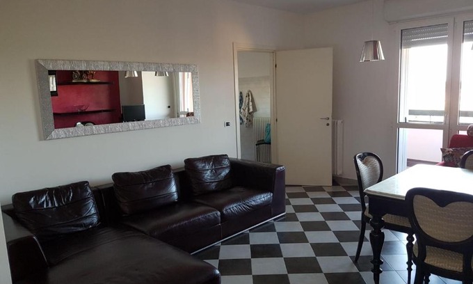 Granarolo dell'Emilia Apartment | Modern Black and White Apartment with Family-Friendly Amenities