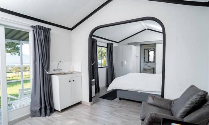 Hartbeespoort Ski Chalet | Discover Comfort at Black and White House with Pool & Dining