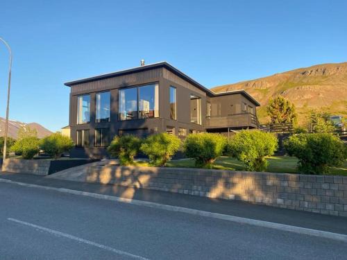 Grenivik Villa | Idyllic Black Pearl Villa with Scenic Views and Hot Tub