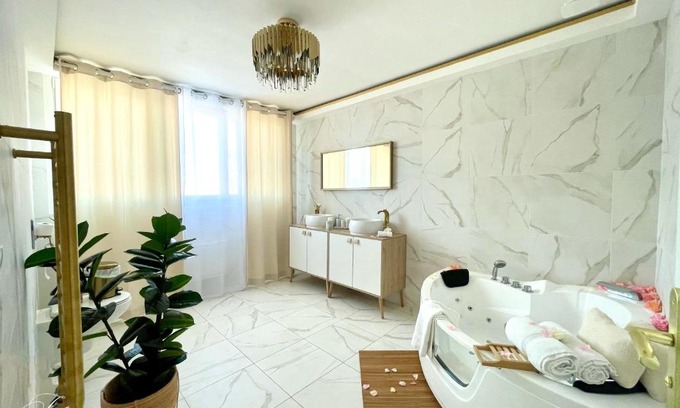 Gare Apartment | Blooming Suites - 4-Star Retreat with Hot Tub & Pet Friendly