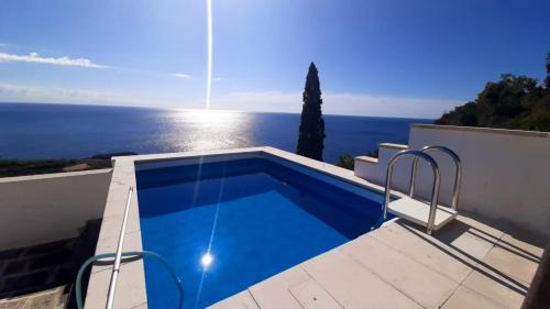 Porto Tricase Ski Chalet | Cozy Blu Suite Cottage with Pool and Oceanfront Views