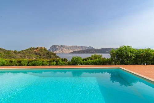 Capo Coda Cavallo House | Relaxing Oceanfront Retreat at Blue Dawn by DomusAway