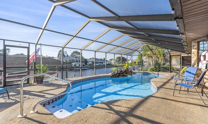 Palm Harbor House | Waterfront Haven with Pool, Dock & Water Views - 10/10 Rated