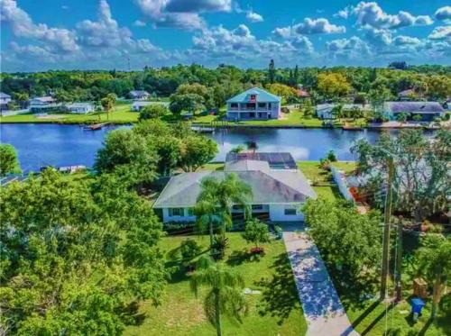 Ruskin House | Experience Blue Heron House: 4 BR Waterfront Retreat with Pool