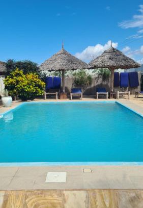 Pwani Mchangani Hotel | Discover Blue Moon Villa: Oceanfront Retreat with Pool