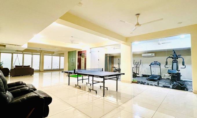 Sushant Lok Apartment | Experience BluO 1BHK with Pool, Kitchen & Balcony Bliss