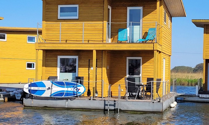 Ostvorpommern Boat Rental | Unique Floating Houseboat Retreat at Kröslin Marina