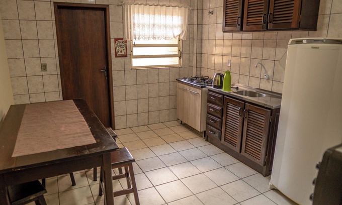 Enseada Apartment | Cozy Apartment Steps from Enseada Beach with Family Perks