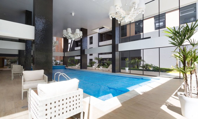 Financial District Apartment | Modern 1BDR Retreat with Pool, Gym & Netflix Access