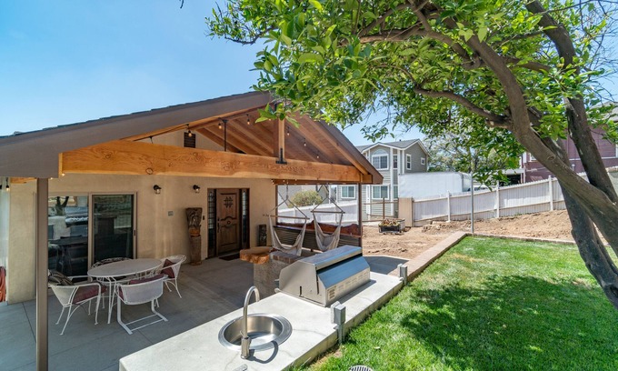 Orange House | Modern Retreat with Views, Fire Pit & BBQ Area