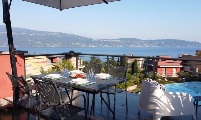 Cecina Apartment | Scenic Lake View Apartment with Free Wi-Fi & Pool Access
