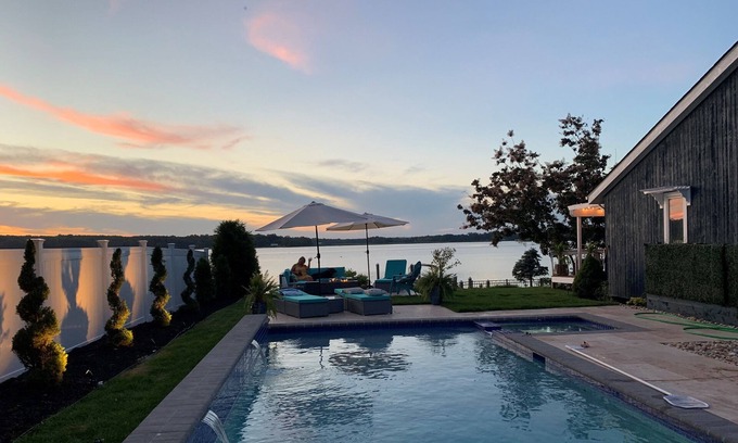 Elkton House | Breathtaking waterfront property with pool, private dock and open floor plan.
