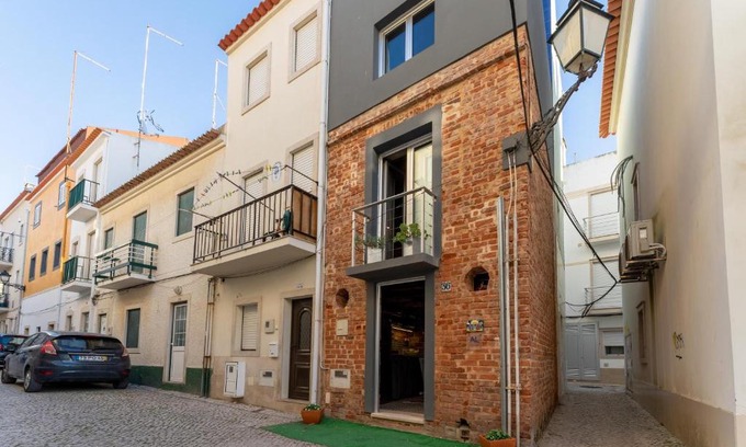Nazare House | Cozy Brick Guest House with Family Kitchen Amenities