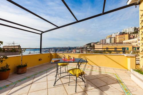 Vittorio Emanuele Apartment | Inviting Oceanfront Retreat at Bright Rooftop by Napoliapartments