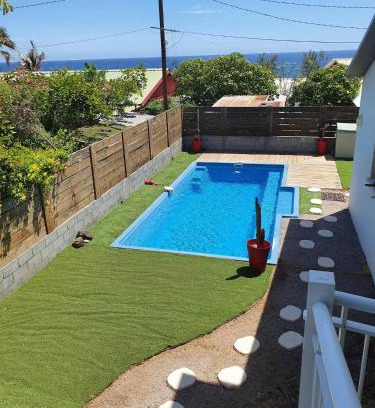 Trois-Bassins Apartment | Relax at Brise Tropicale: Family-Friendly with Pool Access