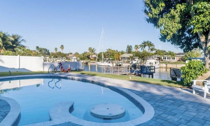 St. Petersburg House | Broadwater Gem: Poolside Retreat with Private Boat Dock
