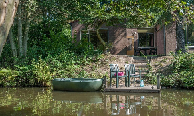 Municipality of Weert House | Charming Waterfront Bungalow with Rowing Boat & Pool