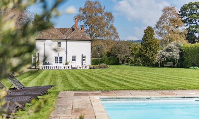Charing House | Comfortable Burleigh House: Pool, Pet Friendly & Family Space