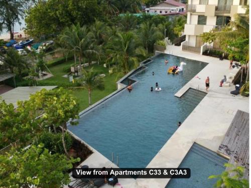 Batu Ferringhi Apartment | Oceanfront Retreat: Pool and Breathtaking Sea Views