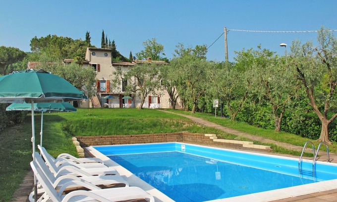 Garda Apartment | Inviting Ca' Pignoi: Poolside Oceanfront Retreat