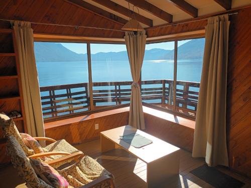 Caburgua Apartment | Cabaña Celeste - Acceso directo a playa lago Caburgua y cancha de tenis - direct access Beach in Caburgua Lake and tenis court