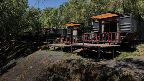 San Pedro de la Paz House | Cozy Cabaña Habitainer BordeRio 3 with Fireplace & Hot Tub