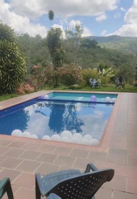 San Gil Apartment | Explore Cabañas Villa Bayona: Pet-Friendly Family Retreat