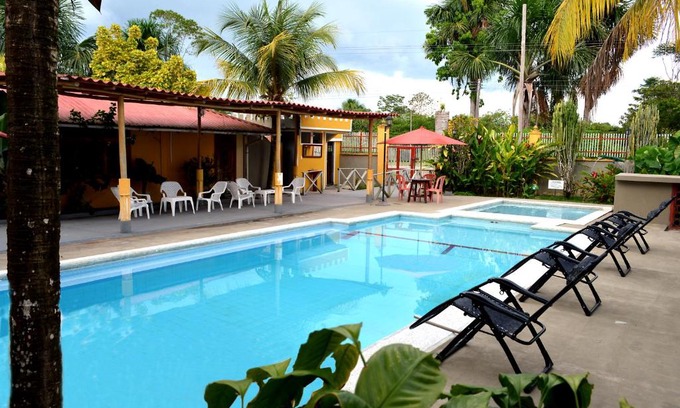 Leticia Hotel | Relaxing Retreat at Cabañas Yakuruna: Pool & Dining Awaits