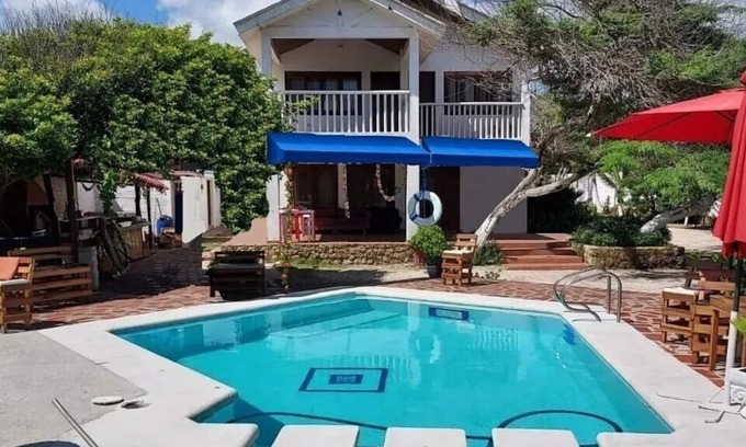 Puerto Colombia Cottage | Relax at Cabana Kiosco: Scenic Lake, Pool & Kitchen Amenities