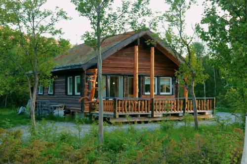 Storslett Cabin | Riverside Cabin: Pet-Friendly Retreat with Family Amenities