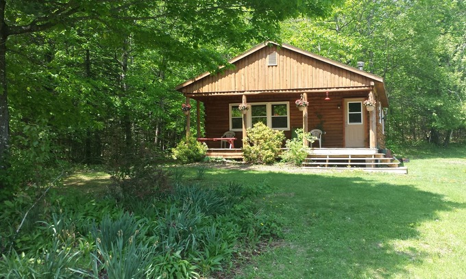 Exeter Cabin | Scenic Cabin Retreat with Trails, Firepit & Pet-Friendly Amenities