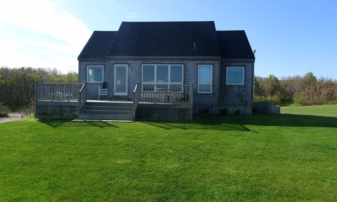 Pocomo House | Cachalot cottage on a bluff directly on Wauwinet Harbor