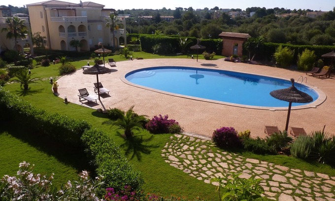 Cala Mandia Apartment | Beachfront Cala Anguila 315: Family-Friendly with Pool