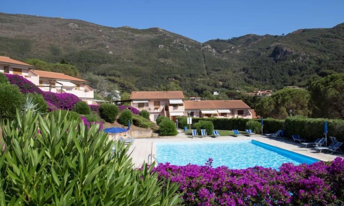 Rio nell'Elba Apartment | Relax at Cala Rossa: Oceanfront Retreat with Pool & Spa