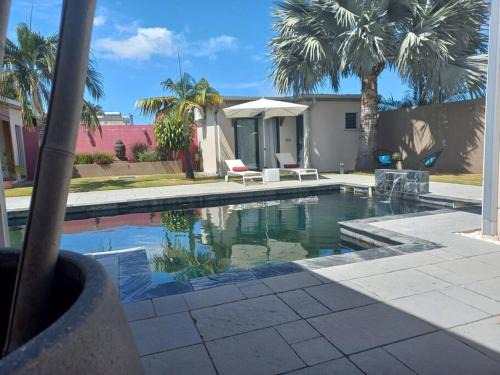 La Riviere Saint-Louis Apartment | Tranquil Retreat with Pool and Ocean Views at La Riviere