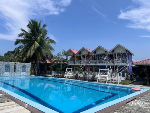 Pulau Tuba Hotel | Tranquil Escape at Capital O 91017 Tuba Beach Resort