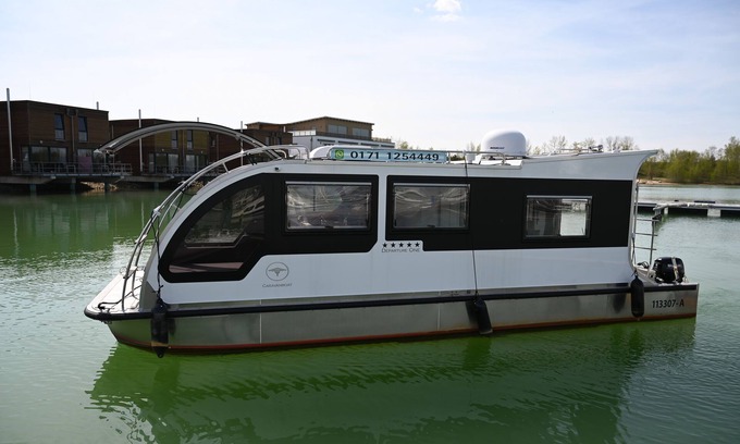 Grossposna Boat Rental | Serene Houseboat at Störmthaler See with Sun Terraces