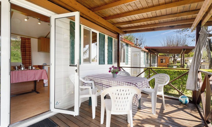 Pratolungo RV Rental | Cozy Caravan 'Mobile Home Comfort 1' with Lake View & Pool