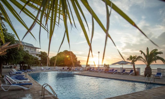 Alcanar Hotel | Explore Carlos III: Oceanfront Views & Poolside Relaxation